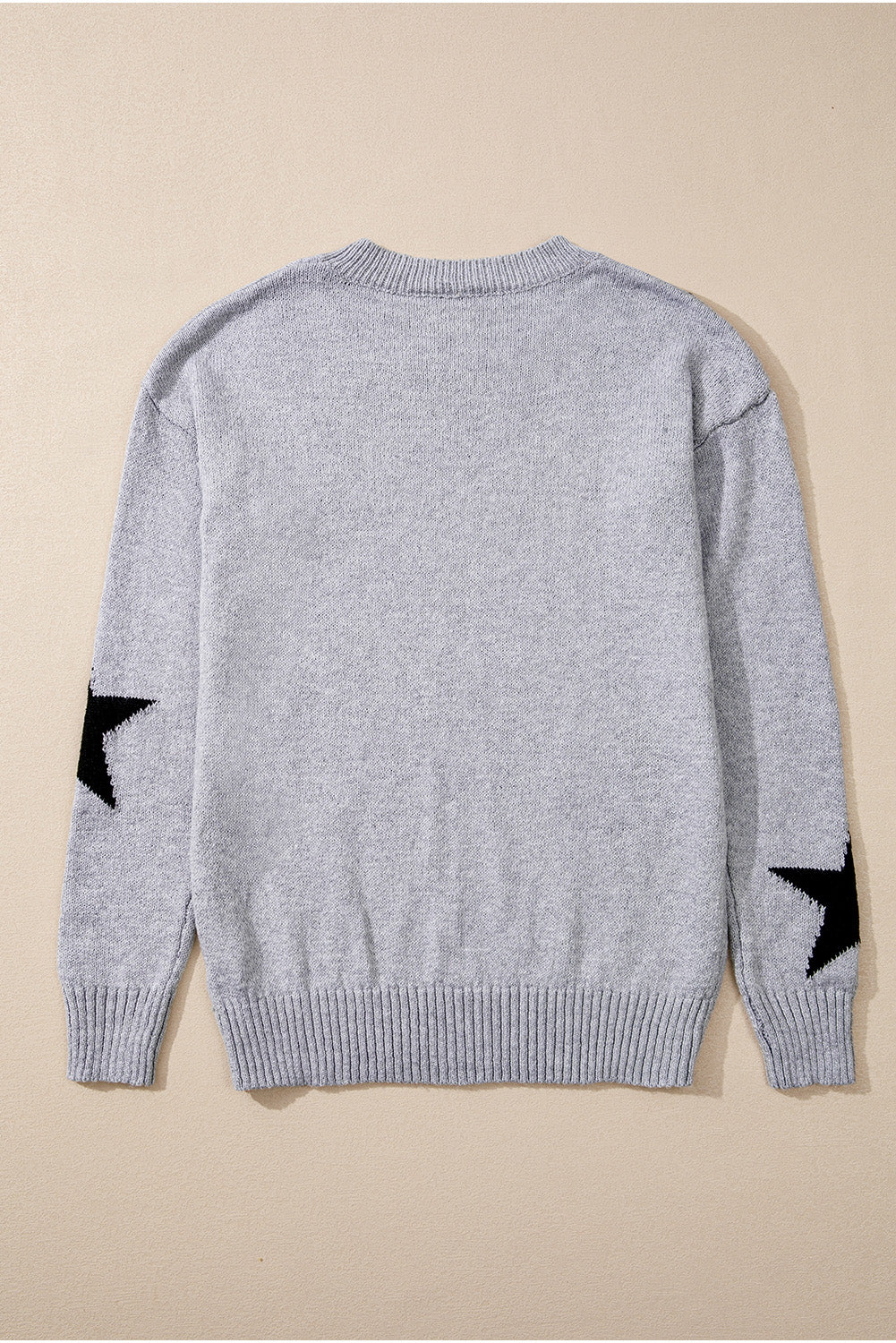 Grauer Pullover mit überschnittener Schulter und Sternmuster