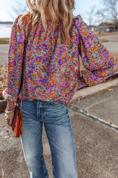 Lila Bluse mit Rundhalsausschnitt, Blumenmuster und gerafften Bündchen