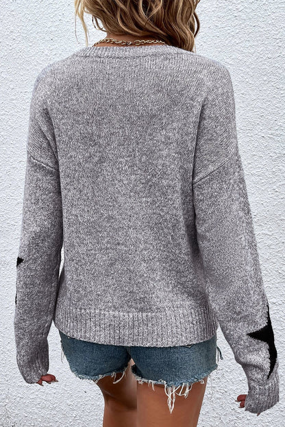 Grauer Pullover mit überschnittener Schulter und Sternmuster