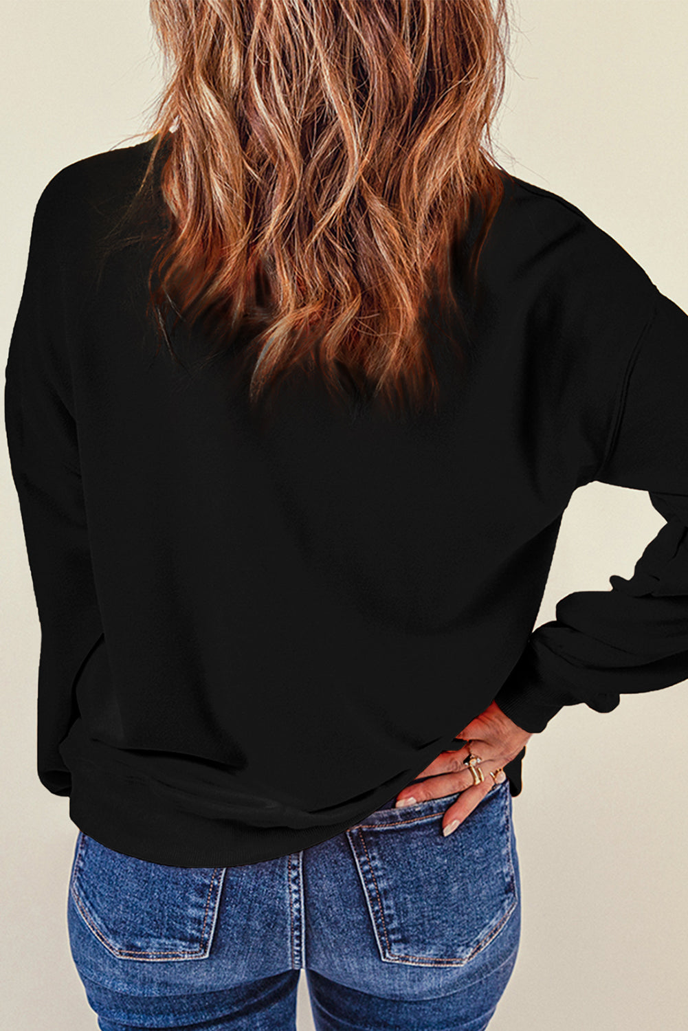 Schwarzes Pullover-Sweatshirt mit Halloween-Kürbis-Grafik und Pailletten