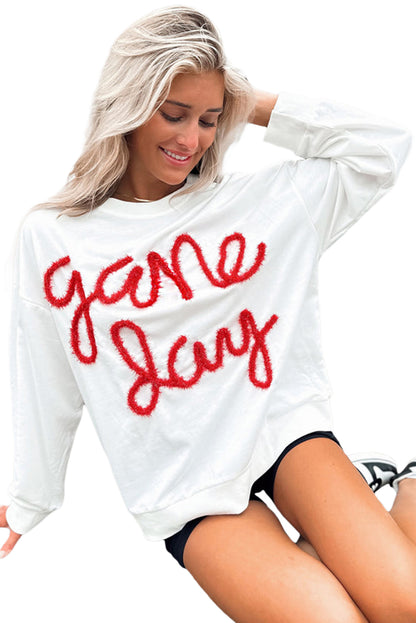 Weißes Lametta-Sweatshirt mit Game Day-Grafik und überschnittener Schulter