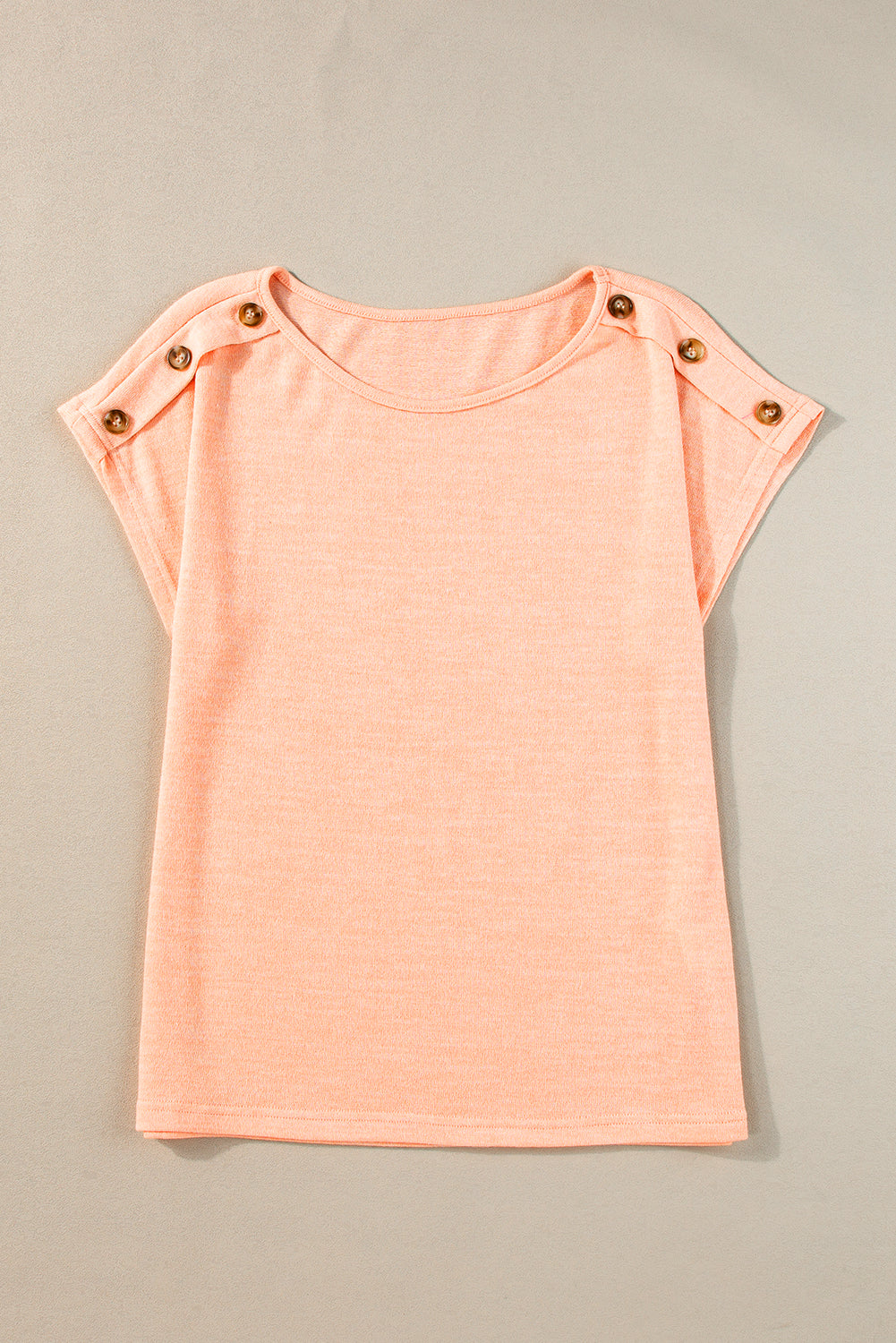 Aprikosenrosa Lässiges T-Shirt mit Fledermausärmeln und Knopfdetail
