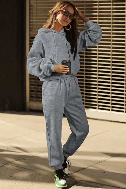 Graues Activewear-Set mit Kapuzenpullover und Jogginghose mit überschnittenen Schultern