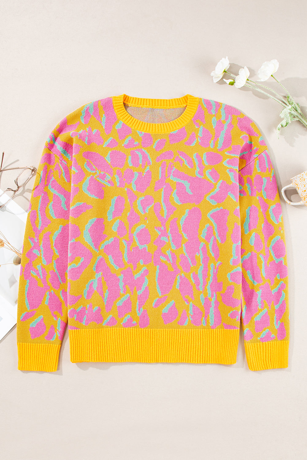Vitality – Orangefarbener Baggy-Pullover mit abstraktem Print und geripptem Saum