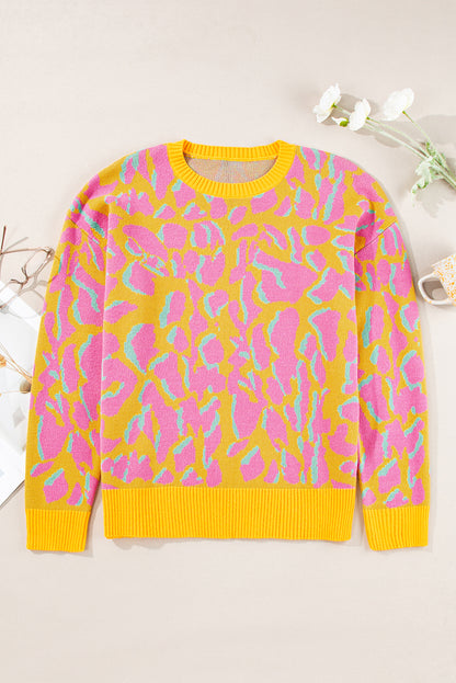 Vitality – Orangefarbener Baggy-Pullover mit abstraktem Print und geripptem Saum