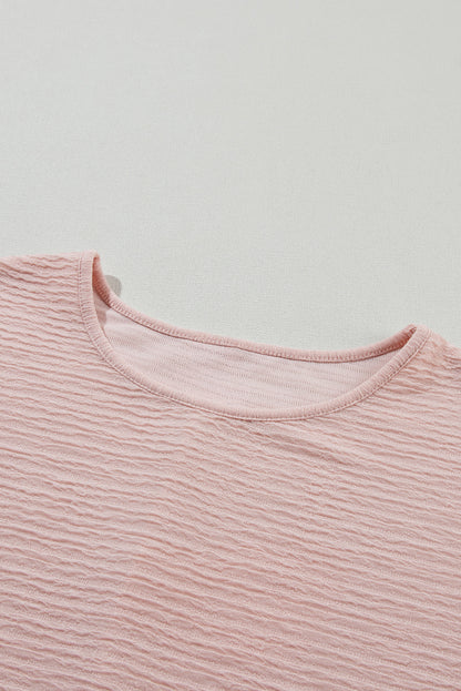 Hellrosa Bluse mit Rüschen und einfarbiger Struktur