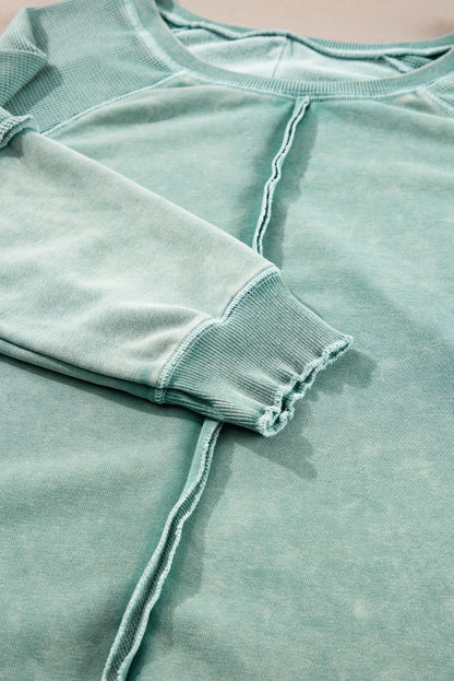 Mineralblaues, einfarbiges Sweatshirt mit Waffelstrick und Patchwork-Raglanärmeln