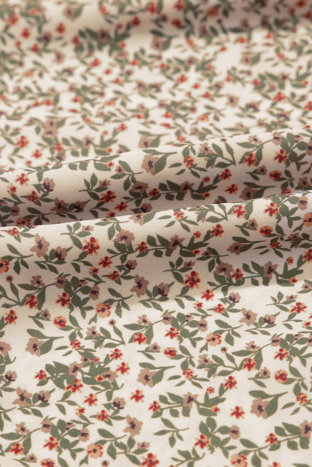 Gesmoktes Top mit Blumenmuster und Puffärmeln