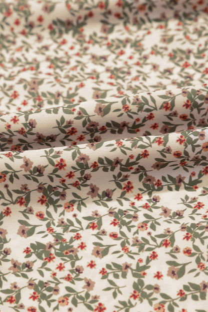 Gesmoktes Top mit Blumenmuster und Puffärmeln