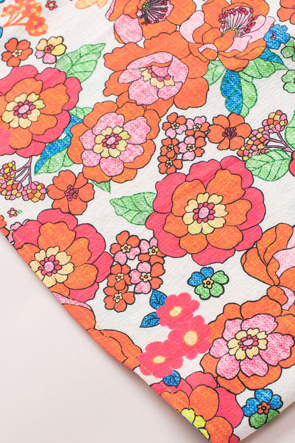 Feurig rotes Top mit Blumenmuster und Schlitz am Ausschnitt