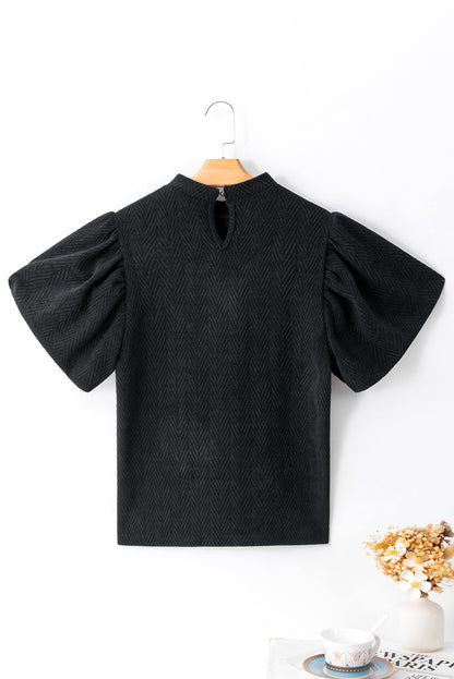 Schwarze Bluse mit Stehkragen und Puffärmeln