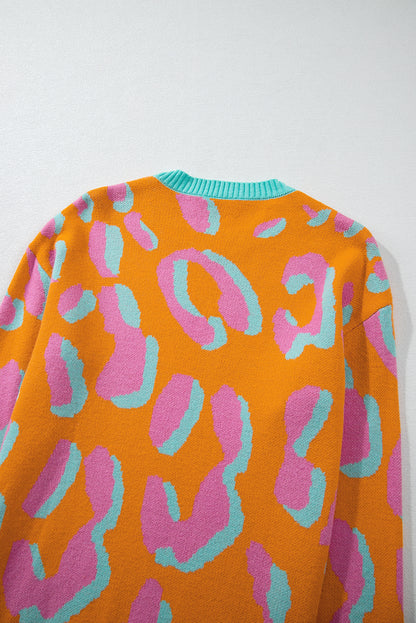 Orangefarbener Pullover mit Leopardenmuster und geripptem Rand im Colorblock-Design