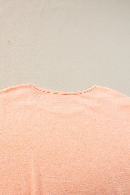 Aprikosenrosa Lässiges T-Shirt mit Fledermausärmeln und Knopfdetail
