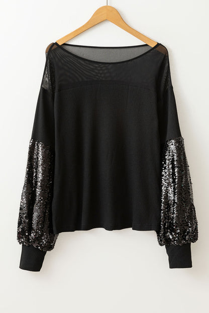 Schwarze Bluse mit Pailletten-Patchwork und Laternenärmeln