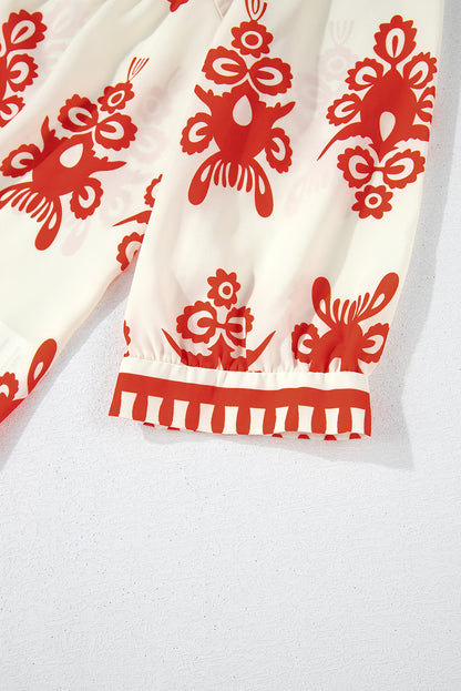 Orangefarbene Bluse mit 3/4-Ärmeln und V-Ausschnitt im Vintage-Stil mit geometrischem Muster