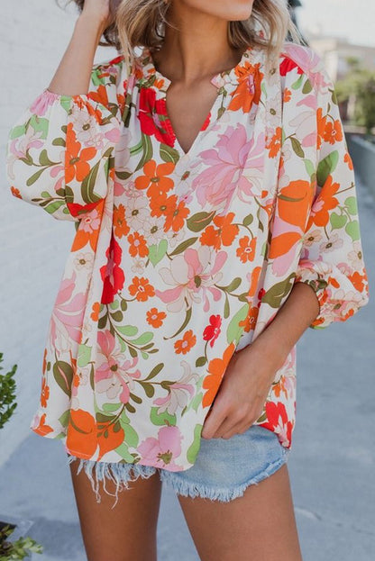 Orangefarbene Bluse mit Puffärmeln und Rüschenbesatz