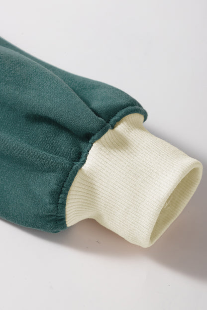 Evergreen Set mit lockerem Pullover in Kontrastfarbe und Skort mit Schnürung in der Taille