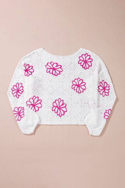 Weißer Pullover mit kontrastierendem Blumenmuster und überschnittener Schulter