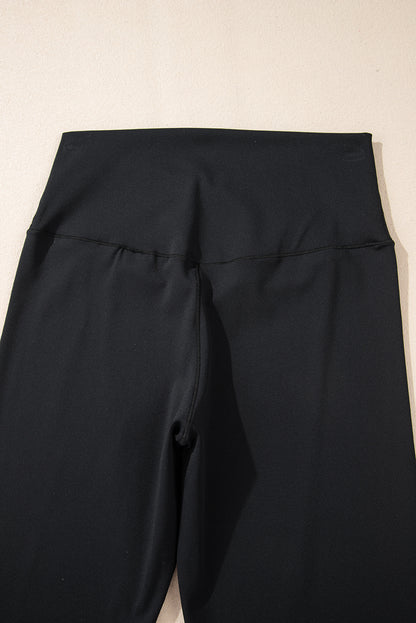 Schwarze, ausgestellte Leggings in V-Form mit hoher Taille