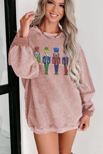 Rosafarbenes, weites Sweatshirt mit Pailletten und Nussknacker-Puppe