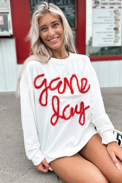 Weißes Lametta-Sweatshirt mit Game Day-Grafik und überschnittener Schulter