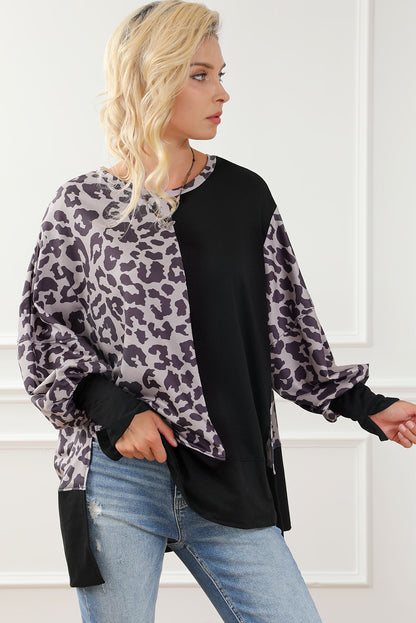 Schwarzes Sweatshirt mit Leoparden-Patchwork und Schlitzen im Bischofsärmel-Stil