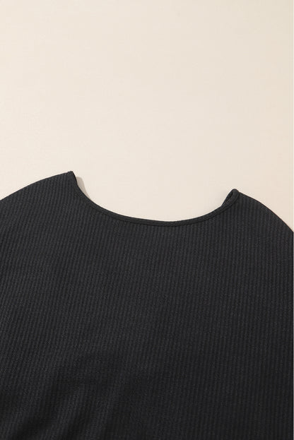 Schwarzes Waffelstrick-Top mit Pailletten und Patchwork-Ärmeln und offenem Rücken
