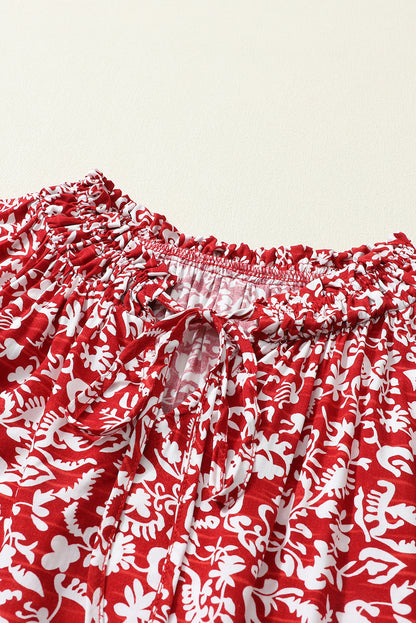 Burgunderrote Bluse mit Blumenmuster und gesmoktem Kragen und Schleife