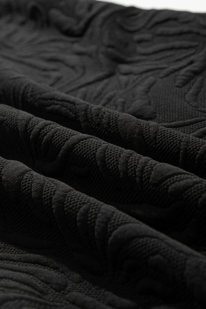 Schwarzes, strukturiertes Jacquard-Minikleid mit Viertelreißverschluss