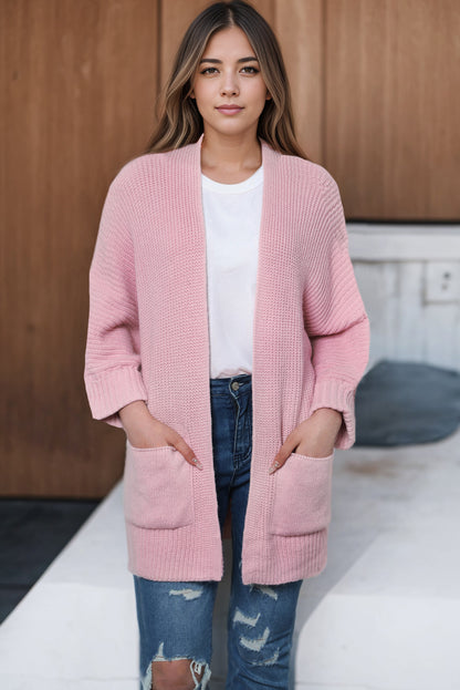 Rosafarbener Oversize-Strickpullover mit umgeschlagenen Ärmeln