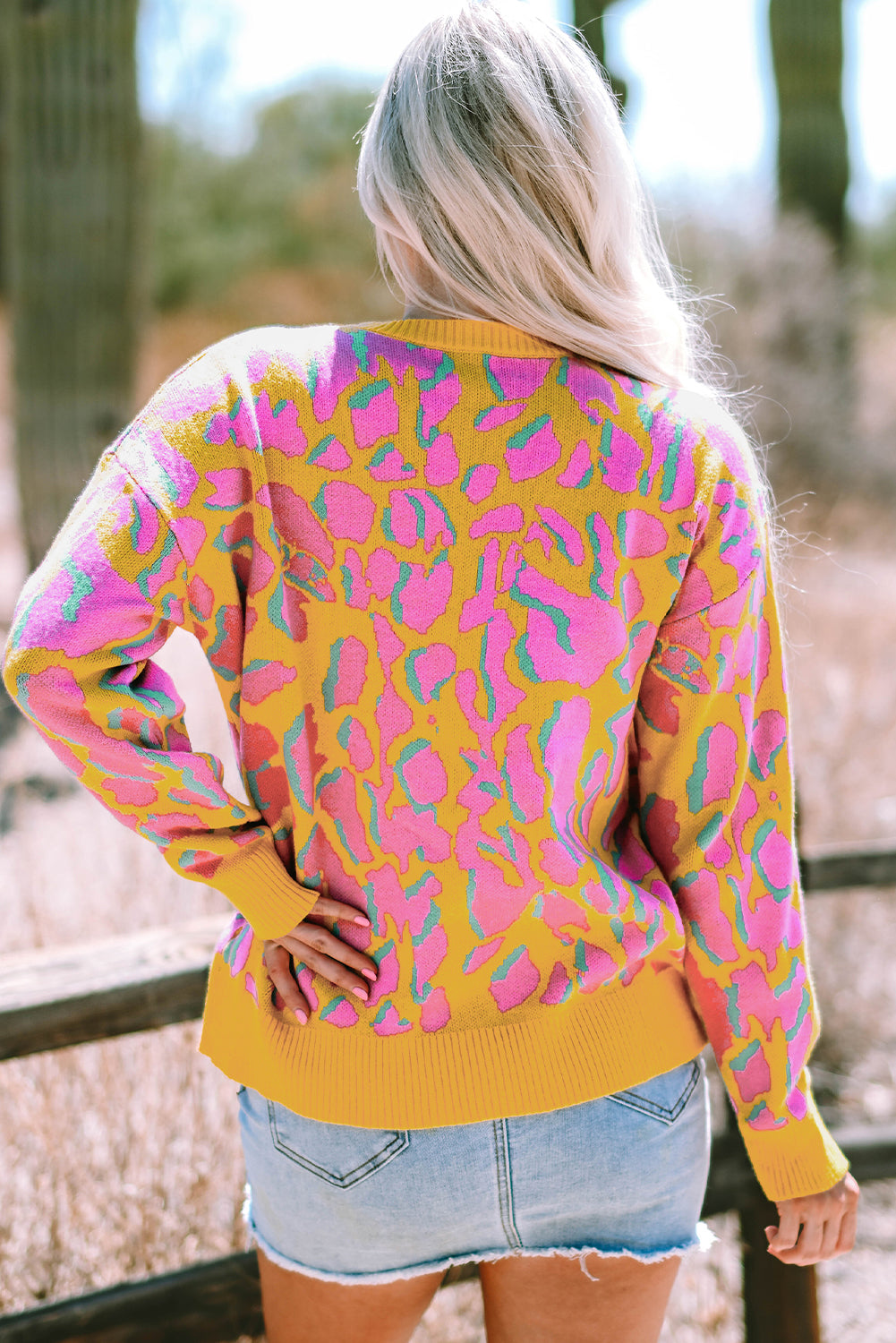 Vitality – Orangefarbener Baggy-Pullover mit abstraktem Print und geripptem Saum