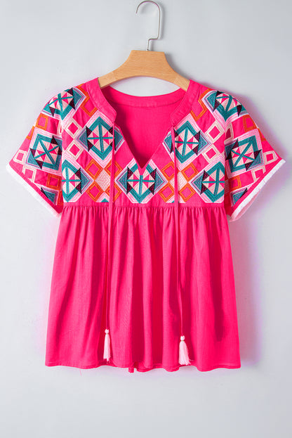 Erdbeerrosa Bluse mit V-Ausschnitt und geometrischer Stickerei, Quaste und Schleife