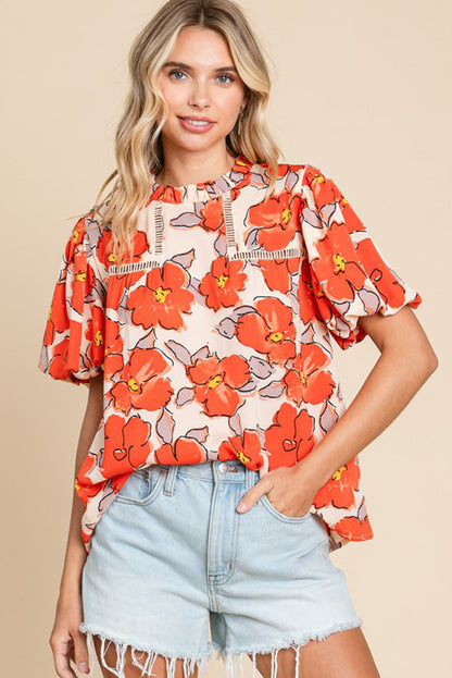 Orangefarbene Bluse mit Blumenmuster, Puffärmeln und Rüschenkragen