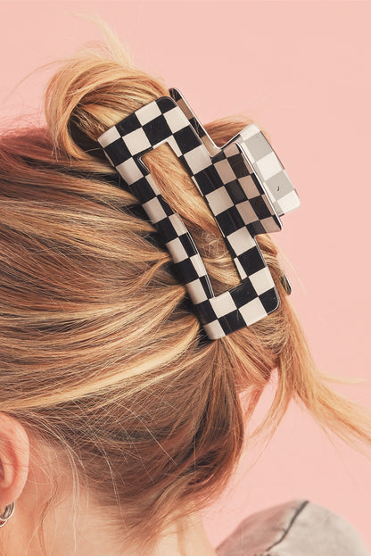 Schwarze Haarspange mit Karomuster und Aussparungen