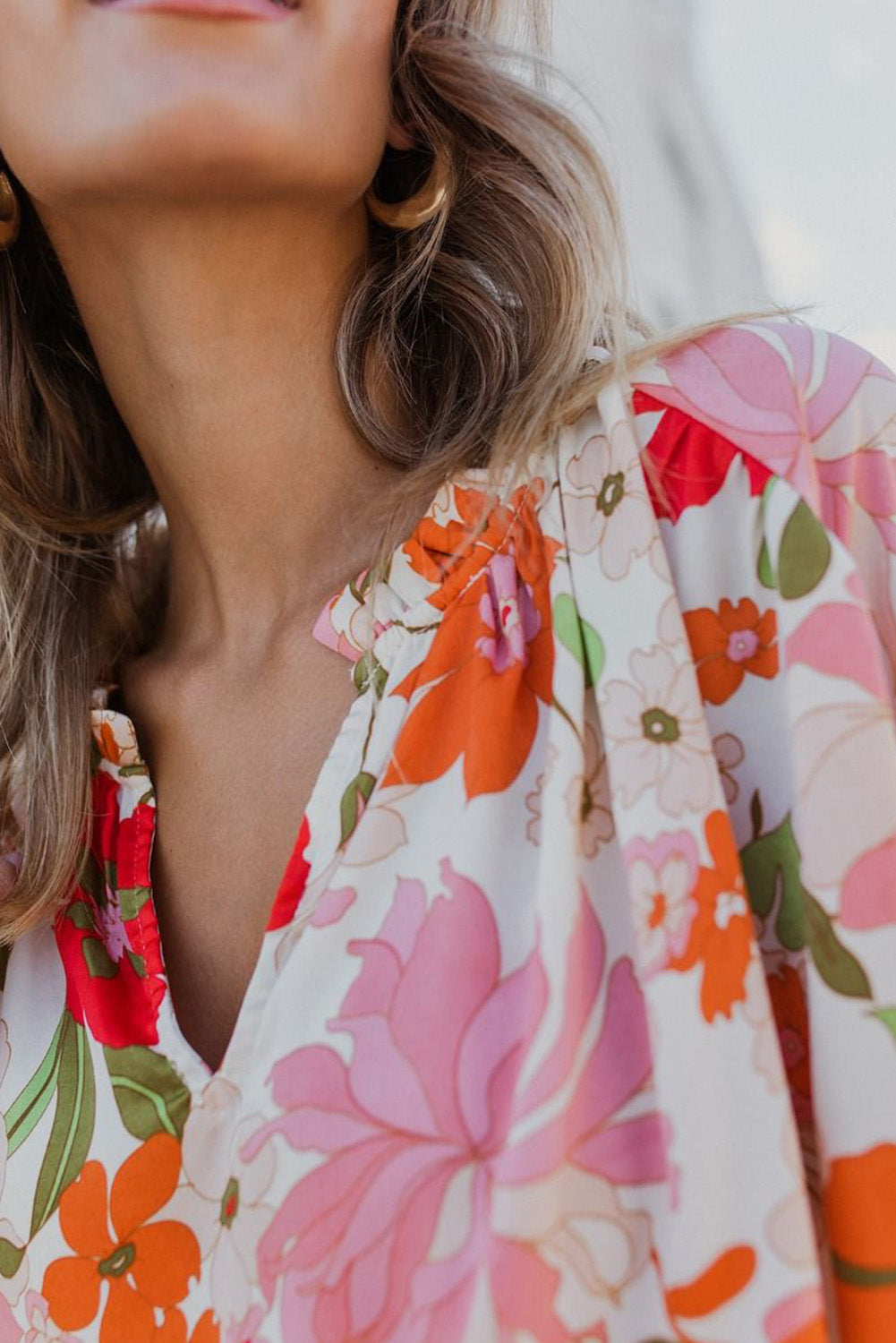 Orangefarbene Bluse mit Puffärmeln und Rüschenbesatz