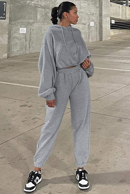 Graues Activewear-Set mit Kapuzenpullover und Jogginghose mit überschnittenen Schultern