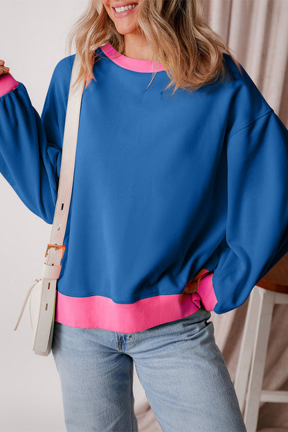 Blaues Sweatshirt mit Farbblock-Muster und Puffärmeln