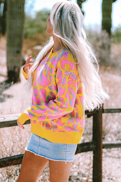 Vitality – Orangefarbener Baggy-Pullover mit abstraktem Print und geripptem Saum