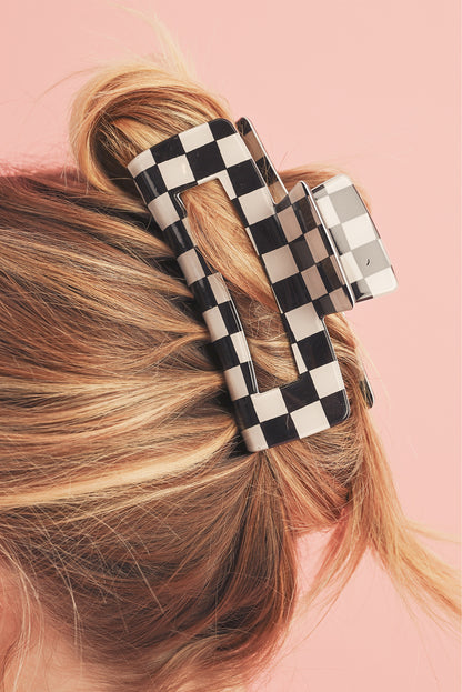Schwarze Haarspange mit Karomuster und Aussparungen