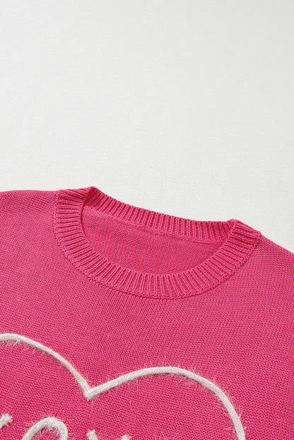 Rippstrickpullover mit überschnittener Schulterpartie und Rosenherz-XOXO-Muster