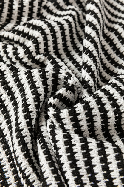 Schwarzes, gestreiftes Langarm-Top mit Rundhalsausschnitt und überschnittener Schulter