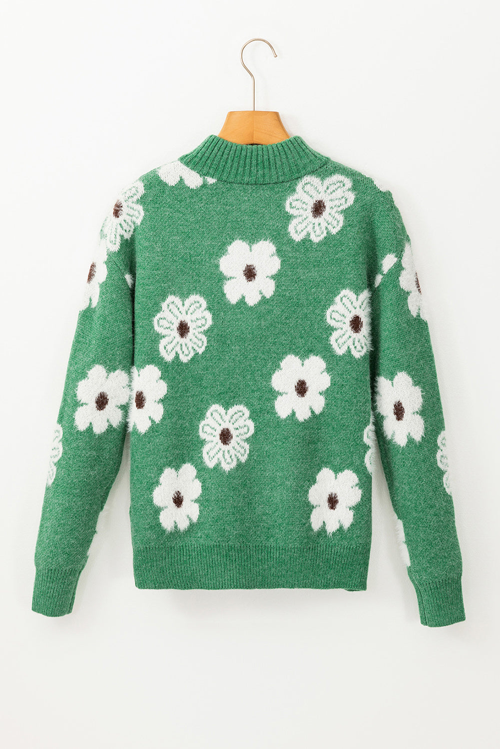 Grüner Pullover mit Blumenmuster und halblangem Reißverschluss sowie überschnittenen Schultern