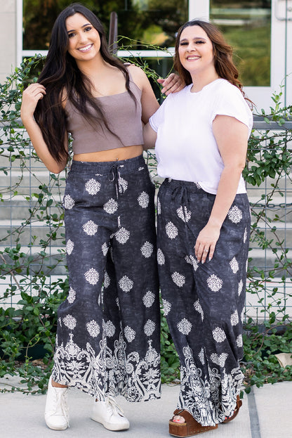 Schwarze Hose mit weitem Bein und Bohemien-Print