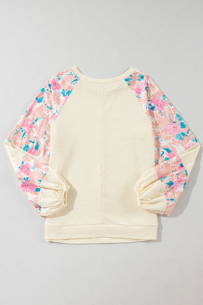 Aprikosenfarbene Bluse mit strukturiertem Patchwork und Ballonärmeln