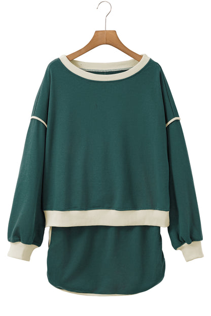 Evergreen Set mit lockerem Pullover in Kontrastfarbe und Skort mit Schnürung in der Taille