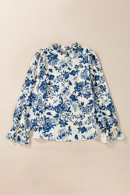 Himmelblaue Bluse mit Blumenmuster, Volantärmeln und Schlüsselloch hinten