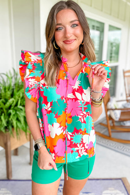 Grüne Bluse mit Blumenmuster, Krawatte, Schlitz am Hals und Rüschenbesatz