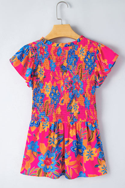 Rosarote Bluse mit Blumenmuster, gesmokten Rüschenbesatz und Flatterärmeln
