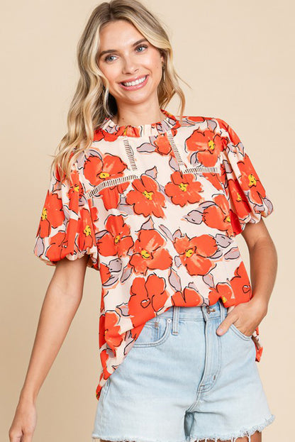 Orangefarbene Bluse mit Blumenmuster, Puffärmeln und Rüschenkragen