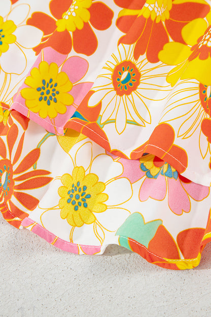 Orangefarbene Bluse mit V-Ausschnitt und halblangen Ärmeln und abstraktem Print